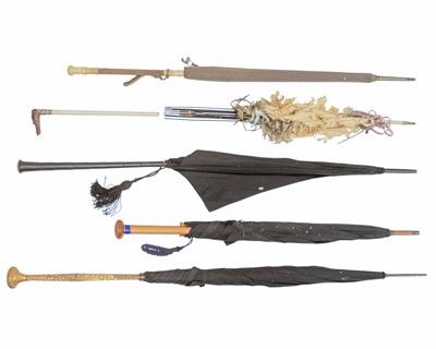 Lot 580 - A Victorian umbrella with black canopy and Secessionist style gilded copper handle.