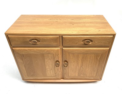 Lot 3243 - An Ercol light elm side cabinet, late 20th...