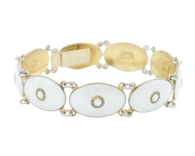 Lot 258 - J. TOSTRUP - A Norwegian silver gilt and white guilloche enamel bracelet.