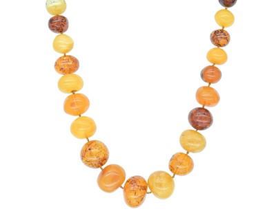 Lot 261 - A mixed amber including butterscotch graduated bead necklace.