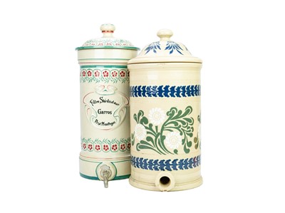 Lot 769 - A late 19th century French stoneware water filter with lid.