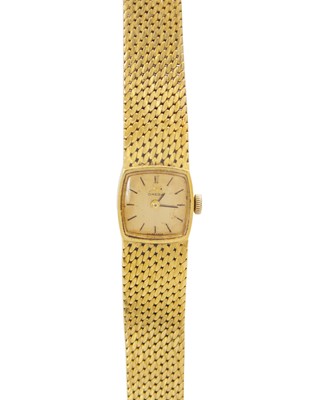 Lot 645 - OMEGA - A 1960's 18k lady's manual wind bracelet wristwatch.