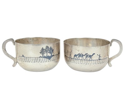 Lot 406 - Two Iraqi white metal niello cups.