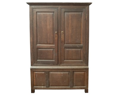 Lot 757 - An early George III oak press cupboard.
