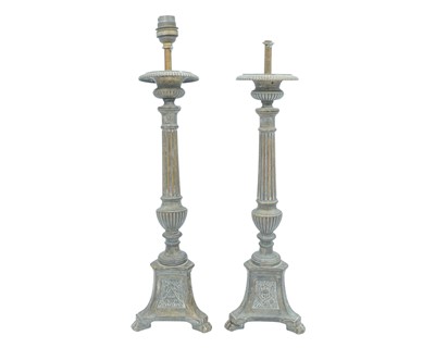 Lot 103 - A pair of ecclesiastical brass candlesticks.