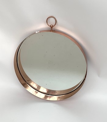 Lot 3167 - A circular copper mirror.