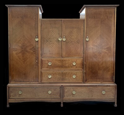 Lot 3136 - An Arts and Crafts walnut wardrobe, by Liberty...