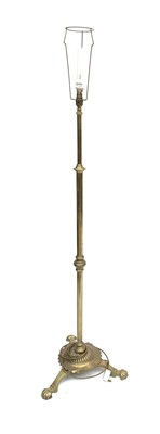 Lot 3156 - A brass standard lamp, tripod feet. 156cm