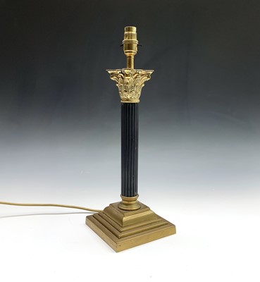Lot 94 - A brass and black painted metal corinthian...