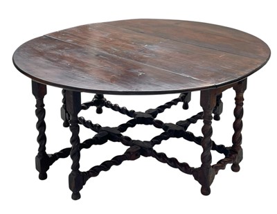 Lot 731 - An oak gateleg dining table of generous proportions.