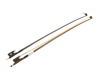 Lot 301 - A late 19th century violin bow.