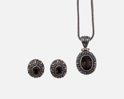 Lot 36 - A modern Balinese 925 & 18k smokey quartz set pendant necklace & matching earrings.