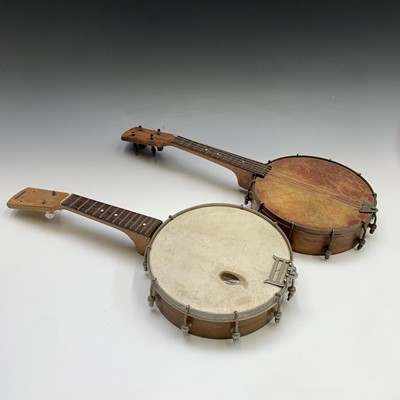 Lot 33 - A small fruitwood four string banjo ukelele,...