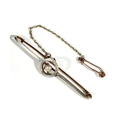Lot 2510 - A 15ct gold and platinum bar brooch with...