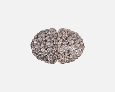 Lot 68 - A modern silver foliate cast and pierced nurses buckle.