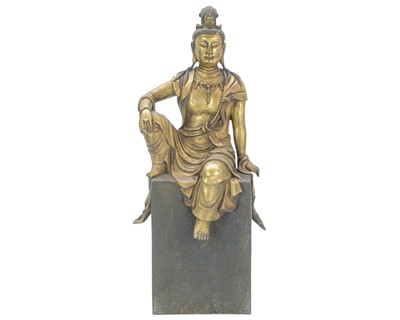 Lot 375 - A Chinese bronze and gilded figure of Guanyin.