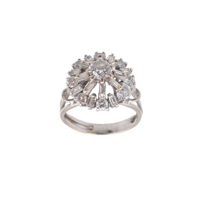Lot 116 - An 18k white gold (tested) diamond set cluster ring.
