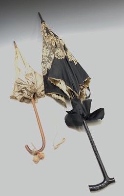 Lot 2821 - A child's cream cotton and lace parasol with...