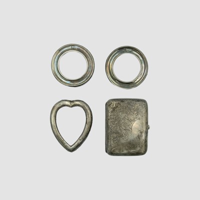 Lot 153 - A George V silver cigarette case, and three small silver-mounted photograph frames.