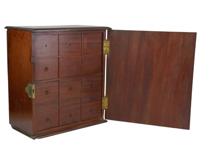 Lot 58 - A late George III mahogany apothecary cabinet.