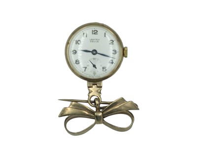 Lot 714A - VERTEX REVUE - A 9k manual wind nurses watch with a bow-shaped brooch fitting.