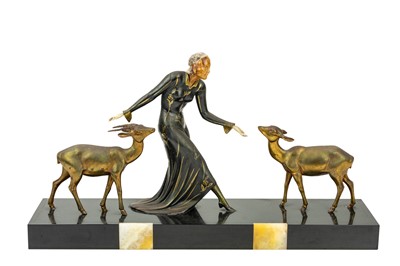 Lot 644 - An Art Deco bronzed group with a female figure and two fawns.