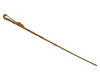 Lot 132 - A folk art carved wood walking stick.