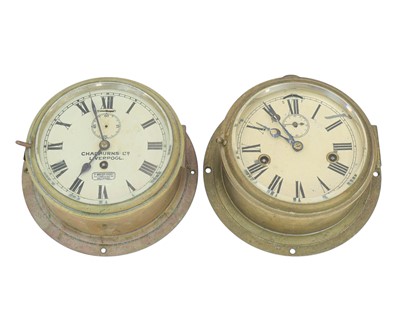 Lot 765 - Two ship's brass cased bulkhead clocks.