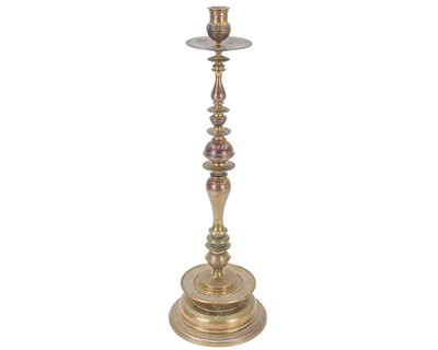 Lot 135 - A large copper candlestick.