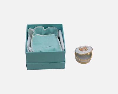Lot 100 - TIFFANY & CO - A French porcelain gilt-metal mounted Capricorn zodiac trinket box.