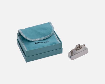Lot 123 - TIFFANY & CO - A silver trinket box in the form of a holdall bag, with original box and pouch.