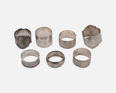 Lot 192 - A collection of seven silver napkin rings.
