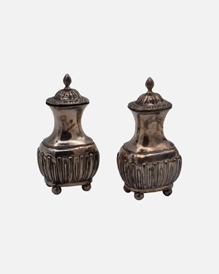 Lot 202 - A pair of Edwardian silver half-fluted salt and pepper shakers by James Deakin & Sons.