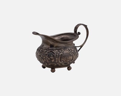 Lot 207 - A Victorian silver cream jug by William Hutton & Sons Ltd.