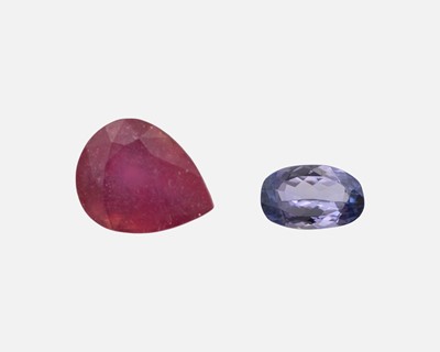 Lot 48 - A glass filled loose ruby and a loose tanzanite.