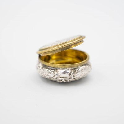 Lot 187 - A nineteenth-century white metal and gilt snuff box.
