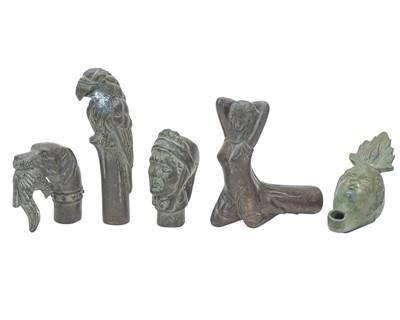 Lot 92 - Four bronze walking cane handles.