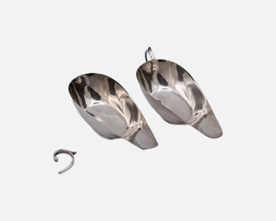 Lot 184 - A pair of George V silver sauce boats by James Woods & Sons.