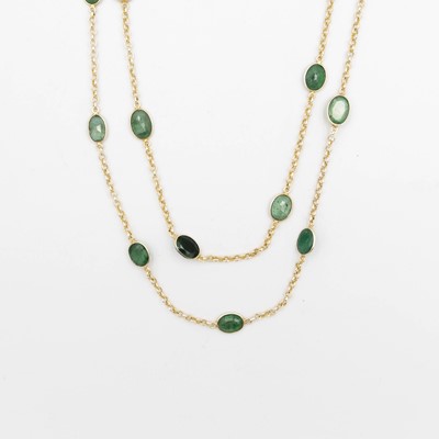 Lot 98 - An emerald spectacle set silver-gilt long necklace.
