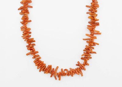 Lot 8 - A long stick coral necklace.