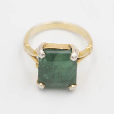 Lot 22 - A silver-gilt cocktail ring, set with a large emerald.