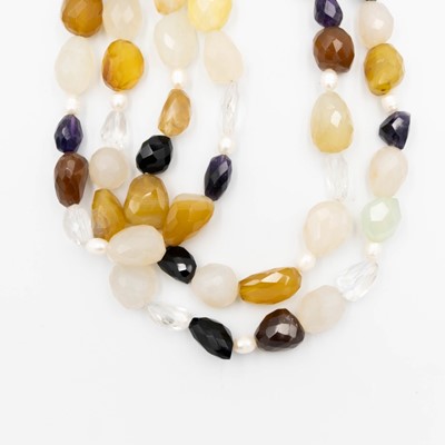 Lot 66 - A mixed quartz faceted bead and cultured pearl three strand necklace, with silver hook fittings.