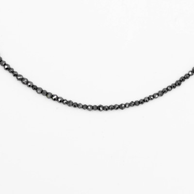 Lot 21 - UNOAERRE - A dainty hematite faceted bead necklace, strung to an 18k spring clasp.