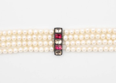 Lot 11 - A cultured pearl four-strand opera length necklace.