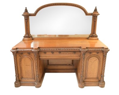 Lot 912 - A Victorian golden oak twin pedestal mirror back sideboard.