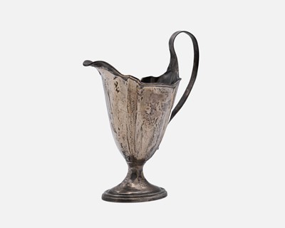 Lot 228 - A silver helmet-shaped cream jug.