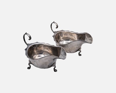 Lot 205 - A pair of George V silver sauce boats by the Barker Brothers.