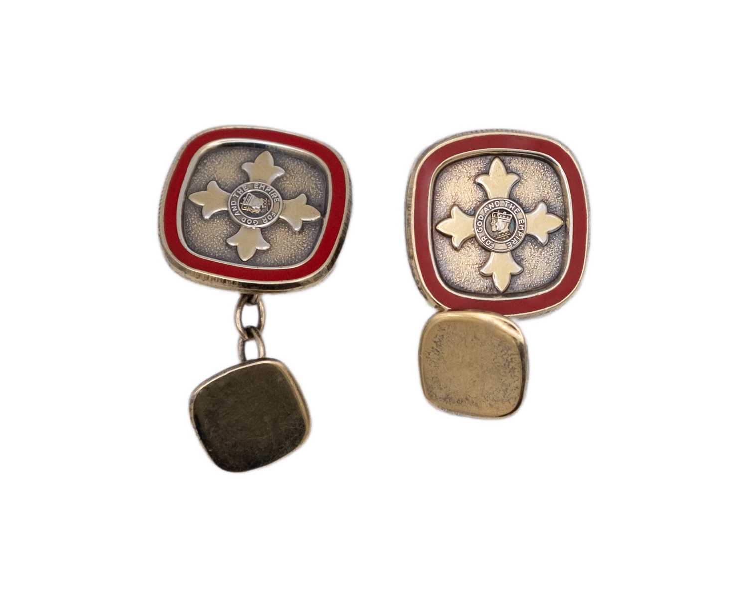 Lot 41 - A pair of sterling silver-gilt red enamel OBE cufflinks, by Toye, Kenning & Spencer Ltd.