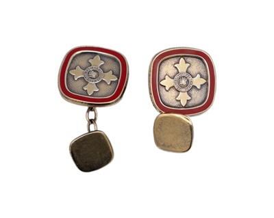 Lot 41 - A pair of sterling silver-gilt red enamel OBE cufflinks, by Toye, Kenning & Spencer Ltd.