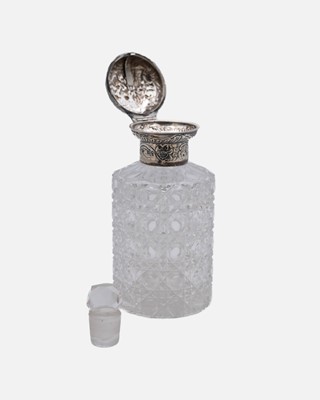 Lot 168 - A Victorian silver mounted scent bottle by William Comyns & Sons.